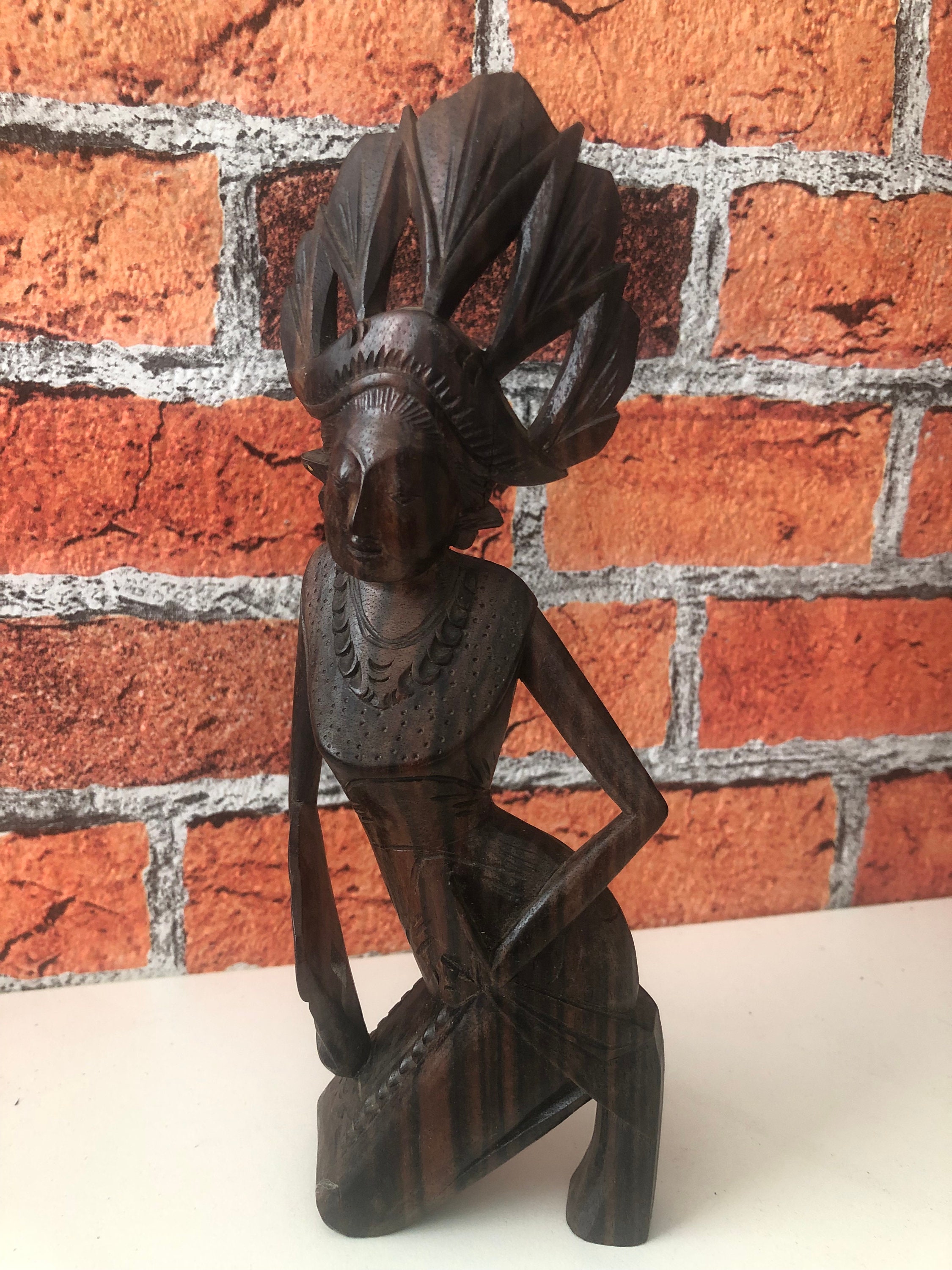 Hand-carved female figure from Bali