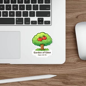 May include: A sticker featuring a cartoon tree with two red apples, green leaves, and a brown trunk. The text "Garden of Eden" and "Gen 2:8-15" are below the tree. The sticker is on a laptop.