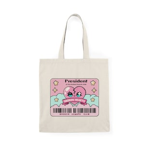 President of the Broken Hearts Club Tote Bag – Recycled Cotton Emotional Statement Bag with Cartoon Heart Design, Funny Sad Gift