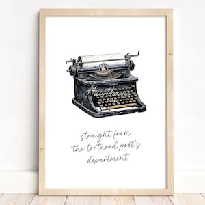 May include: A black vintage typewriter with the text "straight from the tortured poet's department" printed below it.