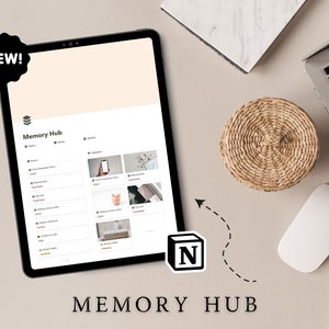 May include: A tablet screen displaying a Notion workspace with the title "Memory Hub". The workspace is organized into sections with topics and highlights. The tablet is on a light beige surface with a laptop, a mouse, and a coaster.