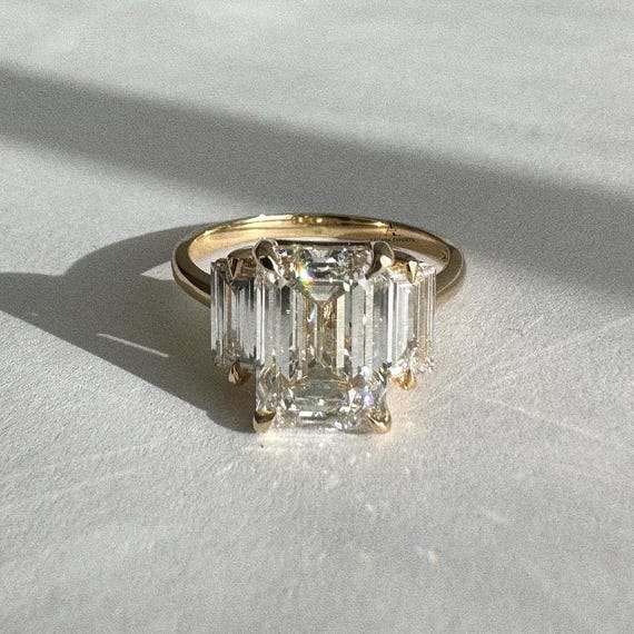 Emerald Cut 3.0 carat E Color VVS2 Clarity IGI Certified Lab Grown Diamond Three Stone Engagement Ring, Side Baguettes 18k Gold