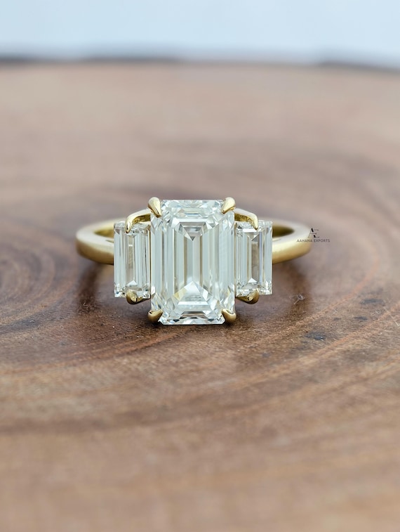 Emerald Cut 3.0 carat E Color VVS2 Clarity IGI Certified Lab Grown Diamond Three Stone Engagement Ring, Side Baguettes 18k Gold