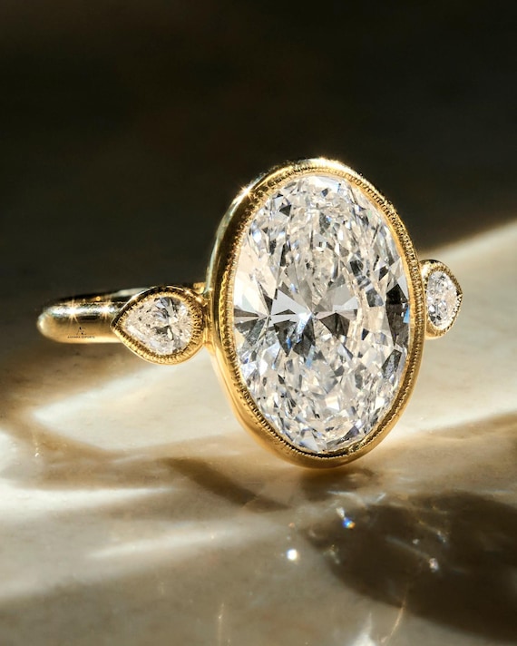 IGI Certified 6 Carat Carat Oval Cut Lab Created Three Stone Diamond Engagement Ring, Full Bezel Milgrain Set, Side Pear Diamonds, 14k Gold