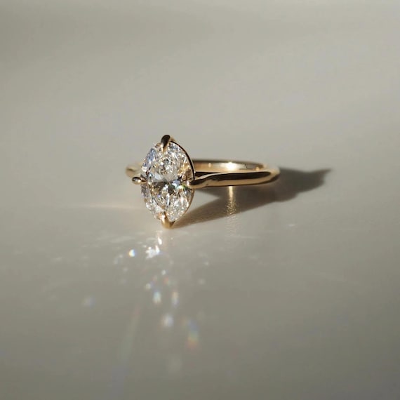 1.00 CT Oval Lab Grown Diamond Ring: Yellow Gold Compass Prong Setting IGI CERTIFIED Diamond Claw Compass Prongs.