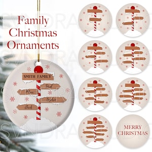 May include: Set of eight round Christmas ornaments featuring a red and white candy cane pole with wooden directional signs. One ornament has the text "Smith Family" and names on the signs. Another ornament has the text "Merry Christmas".