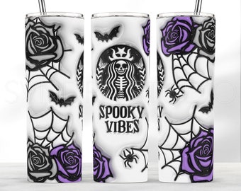 May include: A white Halloween-themed tumbler with a black and purple design. The design includes roses, spiderwebs, bats, and spiders. The center of the tumbler features a skeleton design with the words "Spooky Vibes". The tumbler has a silver straw.