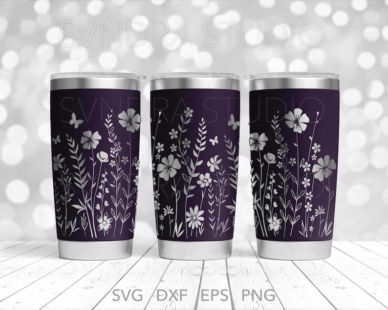 May include: Three stainless steel tumblers with a dark purple background and a white floral design. The design features various flowers, leaves, and butterflies.