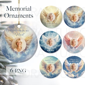 May include: Six round, white, ceramic ornaments with angel wings and clouds. Each ornament has a different quote about heaven and loss. The quotes include "Forever in My Heart", "Forever in Our Hearts", "Heaven is a Beautiful Place", "Always in Our Hearts", "Forever a Little Bit Of Heaven In Our Home", and "Heaven is Our Home".