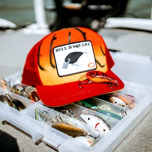 Master Bait Collection - USA Made Twill Cap with Red Crawfish Screen Print Hard Bait Color by The Amygdala Brand.