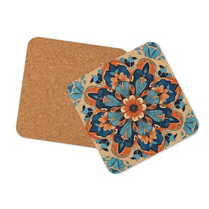 May include: A set of two square cork coasters with a blue, orange, and white mandala design on one side. The other side is plain cork.