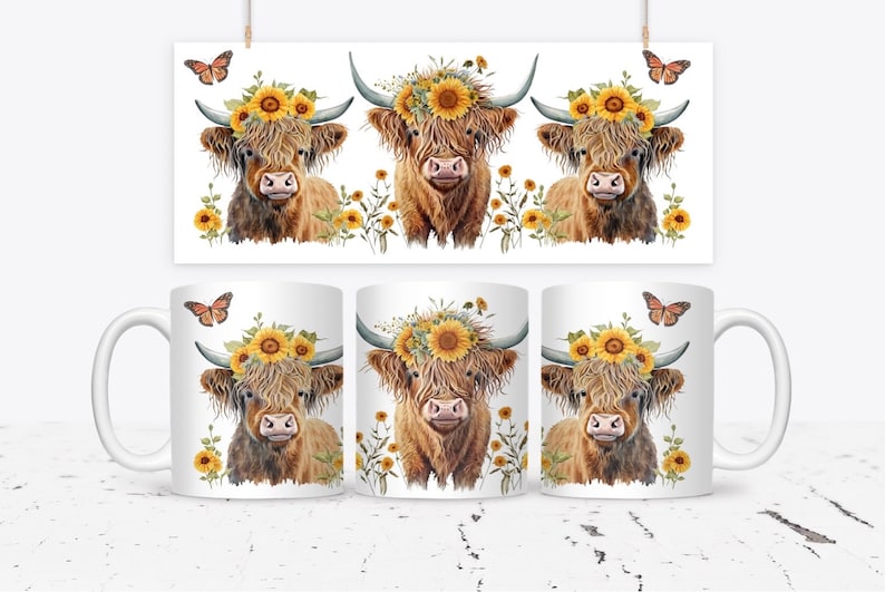 May include: White ceramic coffee mugs with a watercolor illustration of a Highland cow wearing a sunflower crown. The image also features a matching print and butterflies. The mugs are decorated with a brown and yellow color scheme.