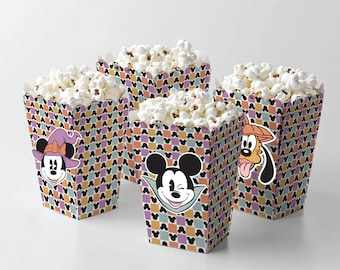 May include: Four popcorn boxes with a checkered pattern featuring Mickey Mouse, Minnie Mouse, and Goofy. The boxes are filled with popcorn and have a Halloween theme.