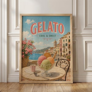 May include: A framed vintage-style print featuring the word "Gelato" in large, red letters against a blue sky background. The image includes a table with gelato, a coastal town, and a scenic view of the sea. The gelato is served in a glass bowl.