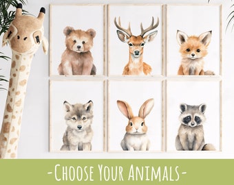 May include: Six watercolor illustrations of woodland animals, including a bear cub, deer, fox, wolf pup, rabbit, and raccoon. Each animal is depicted in a simple, whimsical style with a white background. The text "CHOOSE YOUR ANIMALS" appears below the images.
