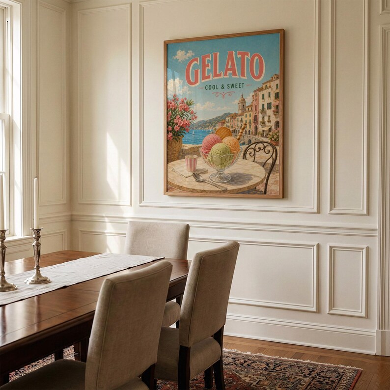 May include: A framed vintage-style poster with the word "Gelato" in red letters. The poster depicts a seaside scene with colorful buildings, a table with ice cream, and the text "Cool & Sweet."