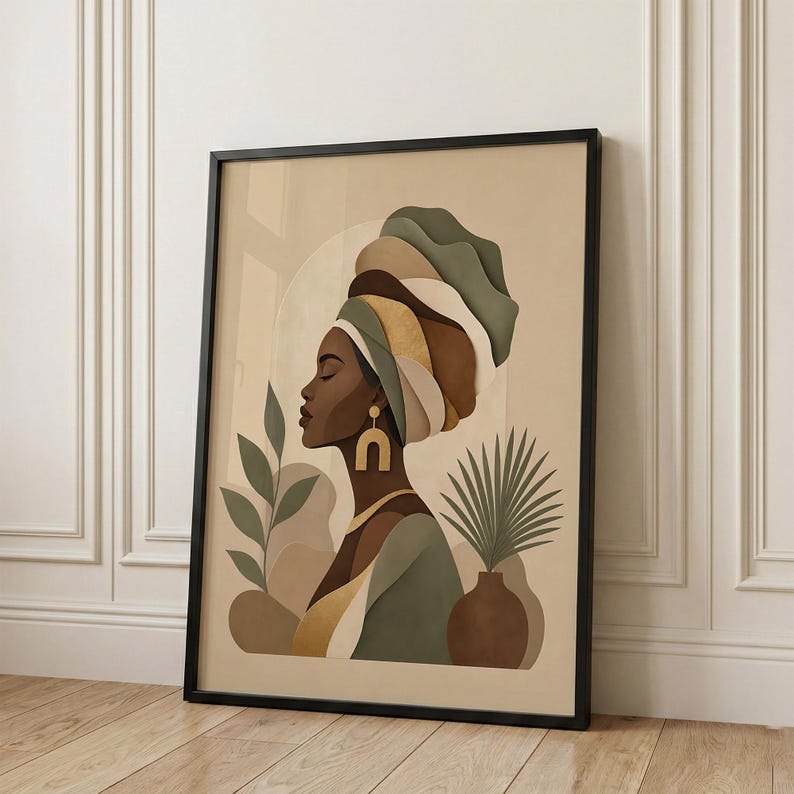 May include: Framed art print featuring a profile of a woman wearing a turban in shades of green, brown, and gold. The artwork includes a vase with a palm frond and other botanical elements. The background is a neutral beige color.