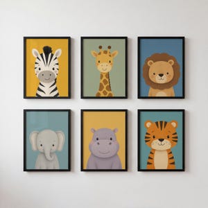 May include: A set of six framed wall art prints featuring illustrated animals including a zebra on yellow, a giraffe on green, a lion on blue, an elephant on blue, a hippo on yellow, and a tiger on blue, all displayed in black rectangular frames.