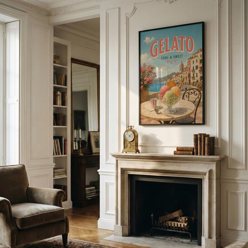 May include: A framed "Gelato Cool & Sweet" poster hangs above a fireplace. The poster depicts a gelato sundae on a table with a coastal Italian town in the background. A gold clock and books sit on the mantel. A brown armchair is in the foreground.