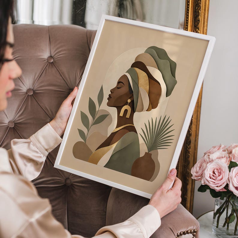 May include: A framed art print featuring a profile of a woman wearing a turban. The artwork uses a palette of beige, brown, and green tones. The woman is adorned with gold jewelry, and the background includes botanical elements.