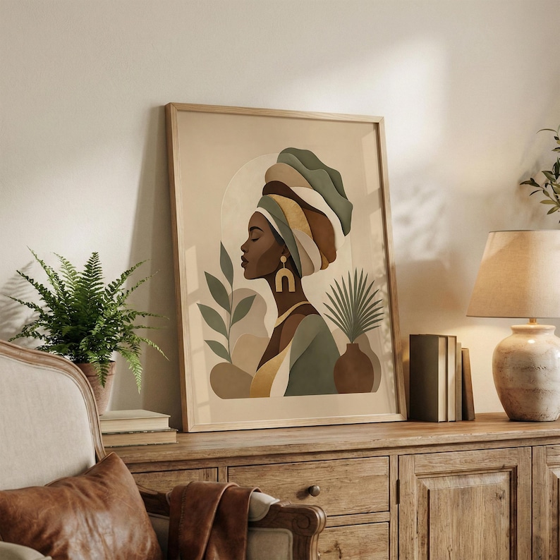 May include: Framed art print featuring a profile of a woman wearing a turban in shades of green, brown, and gold. The artwork includes botanical elements and a neutral color palette, suitable for home decor.