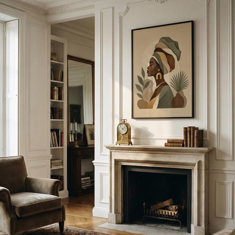 May include: An interior shot features a framed art print of a woman in a head wrap, with a clock and books on the mantel. The room has white walls, a fireplace, and a brown armchair. The art print has a neutral color palette.