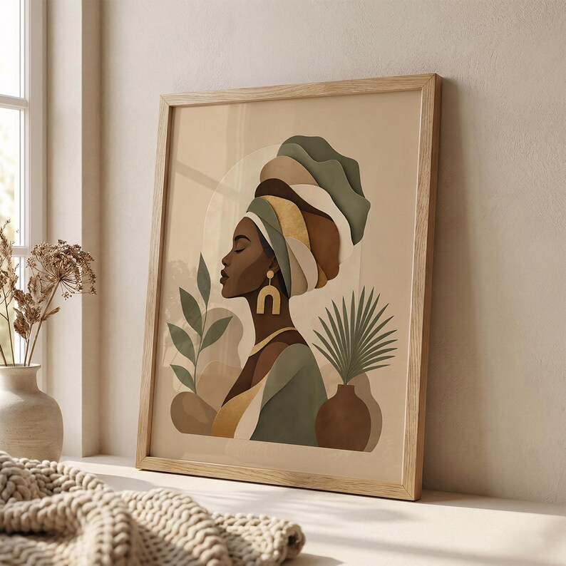 May include: A framed art print featuring a profile of a woman wearing a turban in shades of green, brown, and gold. The artwork includes botanical elements and a neutral background, presented in a light wood frame.
