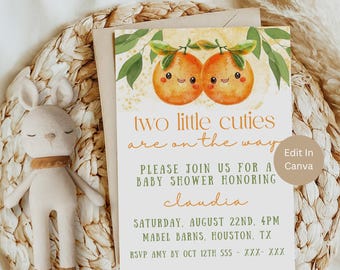 May include: A baby shower invitation with a yellow background and two orange illustrations of oranges with faces. The text reads "two little cuties are on the way" and "Please join us for a baby shower honoring Claudia". The invitation includes the date, time, location, and RSVP information.