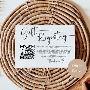 May include: A white gift registry card with black script and a QR code, set against a woven background. The card reads "Gift Registry" and includes text inviting guests to scan the code for a gift list. The words "Thank you" are also visible.