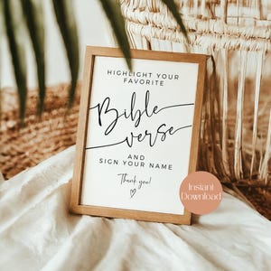 May include: A framed sign with the text "HIGHLIGHT YOUR FAVORITE Bible verse AND SIGN YOUR NAME". The sign has a wooden frame and a white background. A peach-colored circle with the words "Instant Download" is in the lower right corner.