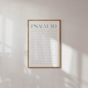May include: A black and white printable wall art print with the text "PSALM 30" and a passage from the Bible. The print is framed in a simple black frame.