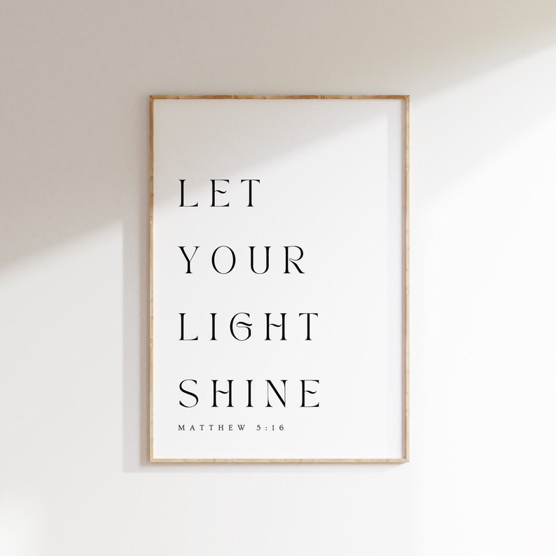 May include: A framed print with the text "LET YOUR LIGHT SHINE" and the scripture reference "MATTHEW 5:16".
