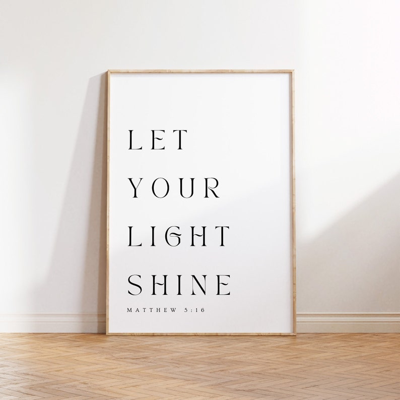 May include: A framed print with the text "LET YOUR LIGHT SHINE" and the scripture reference "MATTHEW 5:16".