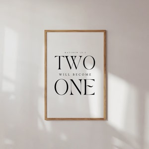 May include: A framed print with the text "TWO WILL BECOME ONE" and the scripture reference "MATTHEW 19:5".