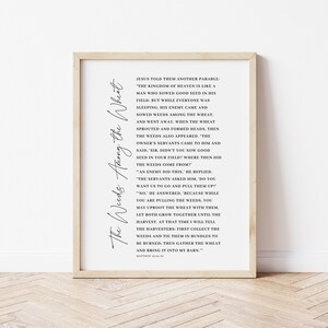 May include: Black and white printable wall art with a quote from the Bible, Matthew 13:24-30, about the parable of the weeds among the wheat. The text is framed in a simple black frame.