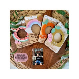 May include: Wooden photo frames with fruit and rainbow designs, perfect for Mother's Day. The frames feature watermelon, orange, and lemon shapes, with the word "Grandma" on top. A small photo is included.
