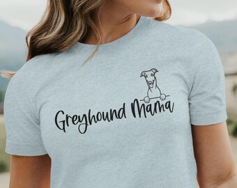 May include: Grey heather t-shirt with a black graphic of a greyhound peeking over the top and the text "Greyhound Mama".