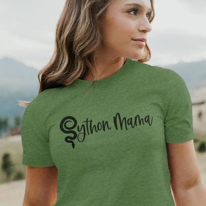 May include: A green t-shirt with a black snake design and the text "Python Mama" printed on the front.