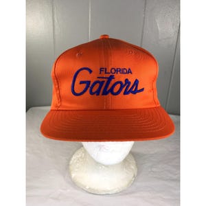 May include: A set of three ceramic nesting bowls in shades of blue, green, and white. The bowls feature a speckled glaze and a simple, modern design. The largest bowl is approximately 7 inches in diameter.