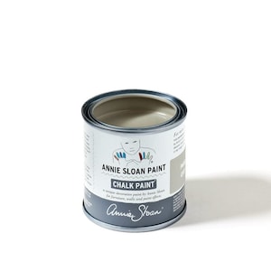 May include: A round metal can of Annie Sloan Chalk Paint in the color French Linen. The can has a white label with the Annie Sloan logo and the text "Annie Sloan Paint Chalk Paint" and "a unique decorative paint by Annie Sloan for furniture, walls and paint effects".