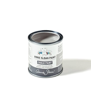 May include: A small can of Annie Sloan Chalk Paint in the color 'Chalky Grey'. The can has a white label with the brand name and a child's handprint design.