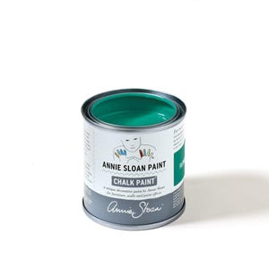 May include: A small, open can of teal-colored chalk paint. The can is silver with a white label featuring the text "ANNIE SLOAN PAINT CHALK PAINT". The paint is for furniture, walls, and paint effects.