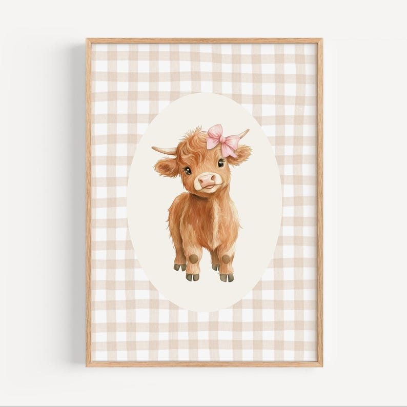 May include: A brown Highland cow with a pink bow on its head, standing in a white oval on a brown and white gingham background.