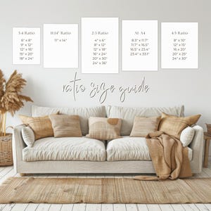May include: A white couch with pillows and a throw blanket in a living room. A wall behind the couch has a white background with a size guide for different print ratios. The guide includes the ratio, and the dimensions in inches for each ratio.