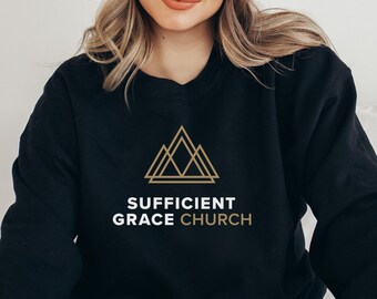 May include: Black sweatshirt with a gold geometric logo and the text "Sufficient Grace Church".