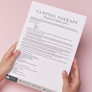 May include: A close-up of a white sheet of paper with the title "Cupping Therapy Treatment Information" printed in black. The text describes the history and benefits of cupping therapy, a form of alternative medicine. The paper is held by a person's hands.
