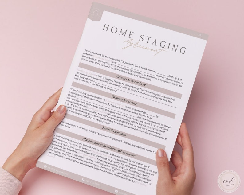 May include: A close-up of a home staging agreement document. The document outlines the services to be rendered, payment for services, term termination, and maintenance of furniture and accessories. The document is held in the hands of a person.