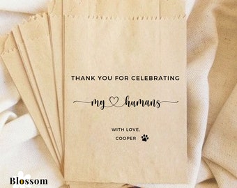 May include: Brown paper favour bags with the text "Thank you for celebrating my humans with love, Cooper" and a paw print.