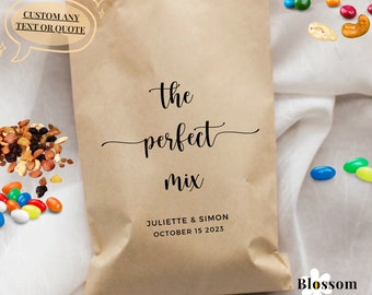May include: A brown paper bag with the text "the perfect mix" and the names "Juliette & Simon" and the date "October 15 2023".