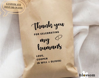 May include: Brown paper bag with the text "Thank you for celebrating my humans Love, Cooper (& Will + Olivia)" printed on it. The bag is decorated with two small hearts.